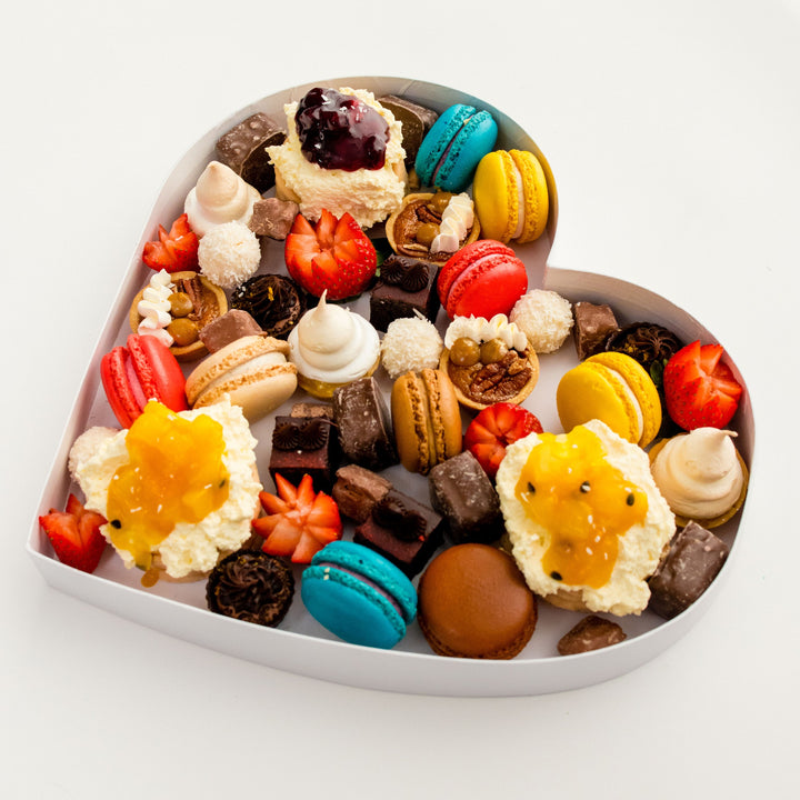 Angled view of an assorted dessert-filled heart
