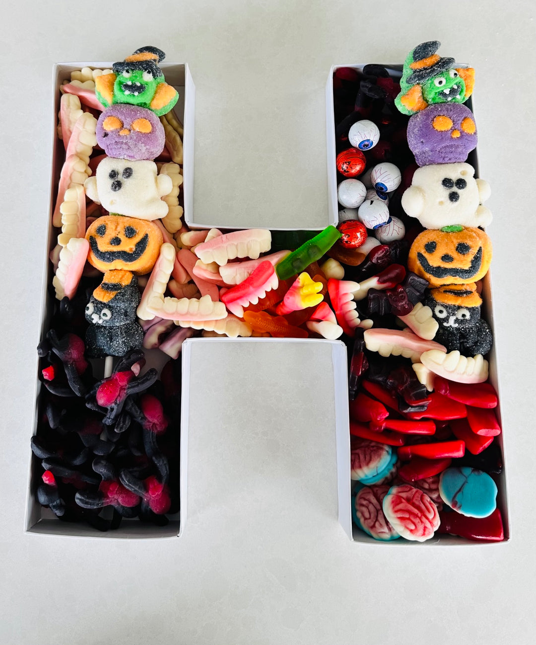 Halloween lolly-filled letter H with spooky sweets